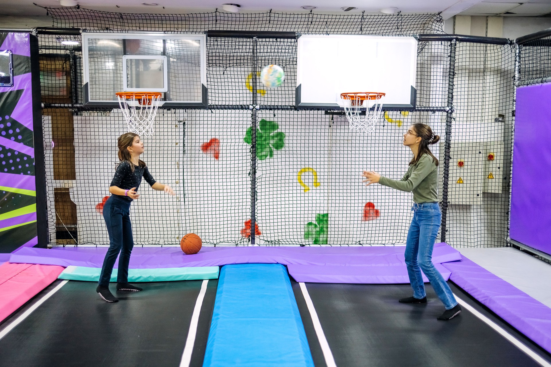 Kids having fun at indoor playground. Jumping on trampoline.